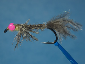 Lucy's hex nymph fly with pink eyes image link.